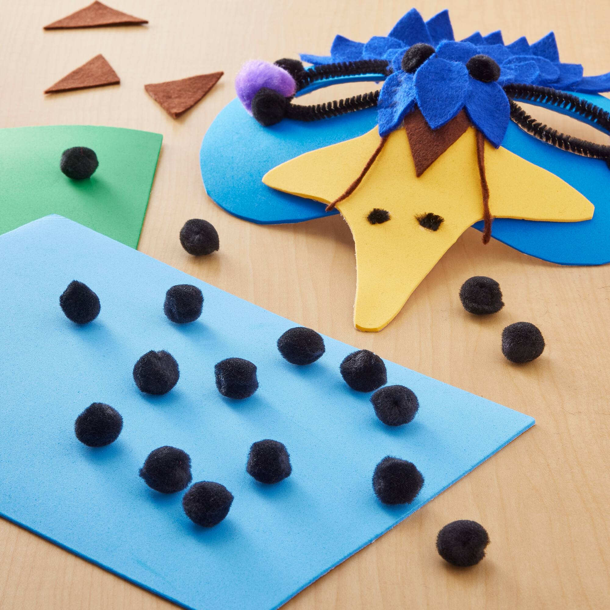 24 Packs: 65 ct. (1,560 total) 1/2" Pom Poms by Creatology